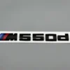 BMW-M550d-emblem-svart