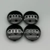 Svarta Audi centrumkåpor 4-pack – navkapslar med ringar för originalfälgar