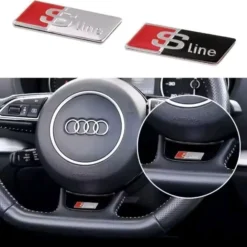 Audi S line ratt emblem i svart och krom – sportig detalj för interiören