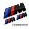 Set med BMW M emblem i blanksvart för baklucka och skärmar – stilren bilstyling