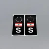 S-märken svart/vit med Lebanon-flagga – 2-pack dekorativa bilmärken för stil och identitet.
